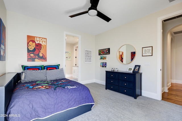 10191 E Diamond Rim Dr Unit 2122, Scottsdale, AZ 85255 - bedroom featuring arched walkways, a ceiling fan, baseboards, and carpet floors