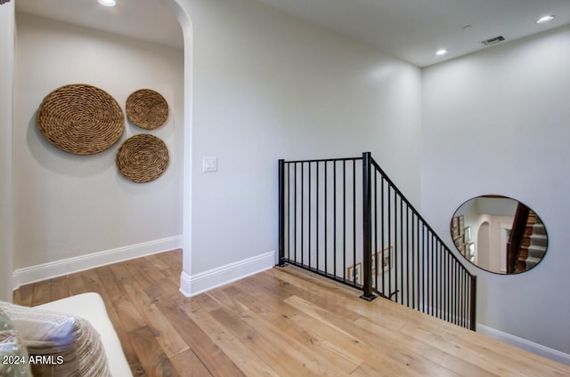 10191 E Diamond Rim Dr Unit 2122, Scottsdale, AZ 85255 - stairs featuring wood-type flooring, baseboards, arched walkways, and recessed lighting