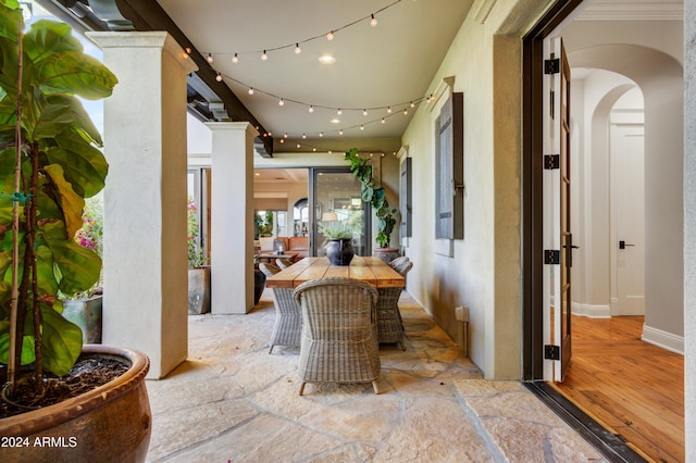 10191 E Diamond Rim Dr Unit 2122, Scottsdale, AZ 85255 - hall with arched walkways and wood finished floors