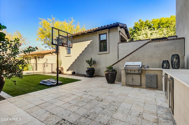 view of patio with area for grilling and grilling area