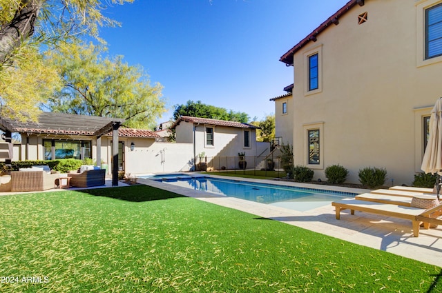 view of swimming pool featuring an outdoor living space, a pergola, a patio area, and a yard