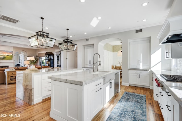 10191 E Diamond Rim Dr Unit 2122, Scottsdale, AZ 85255 - kitchen with arched walkways, a spacious island, gas stovetop, stainless steel dishwasher, and recessed lighting