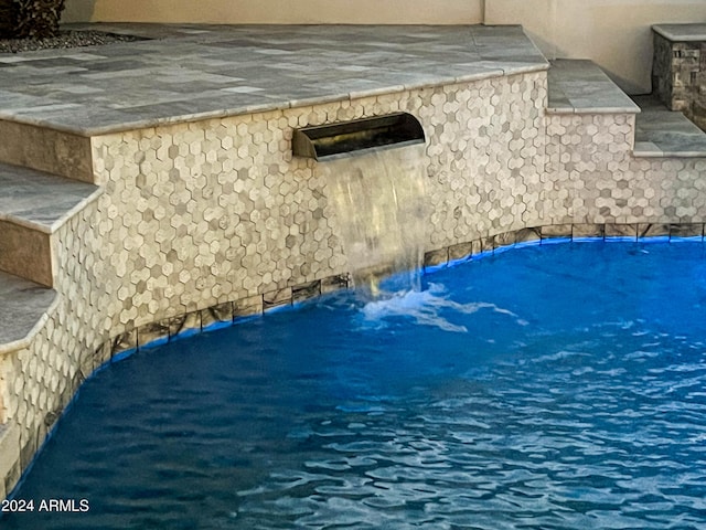 exterior details with a pool