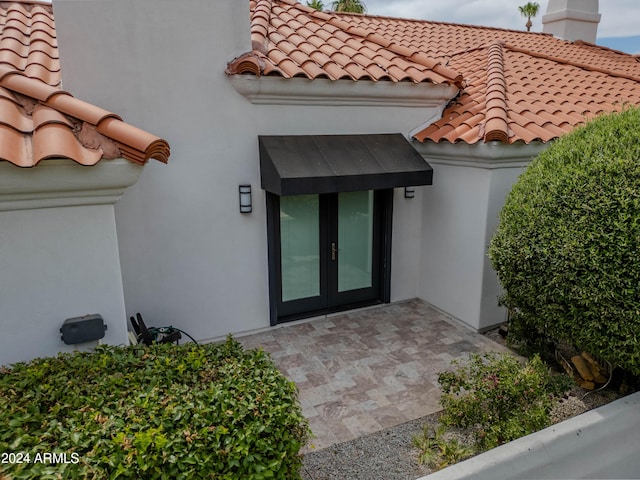 entrance to property featuring french doors