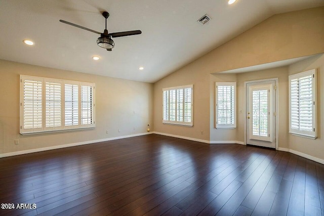 spare room featuring ceiling fan, plenty of natural light, and dark wood-type flooring