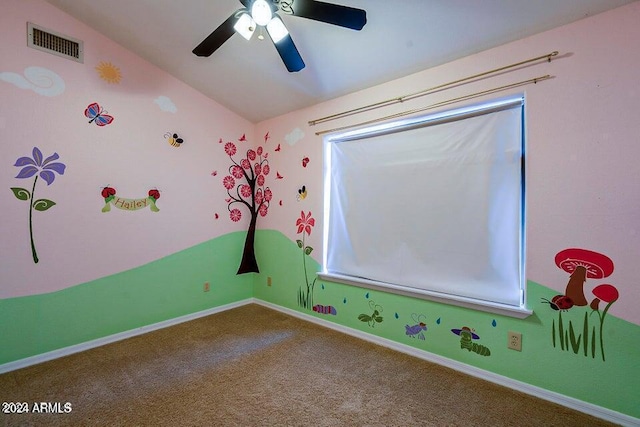 recreation room with carpet flooring, ceiling fan, and lofted ceiling