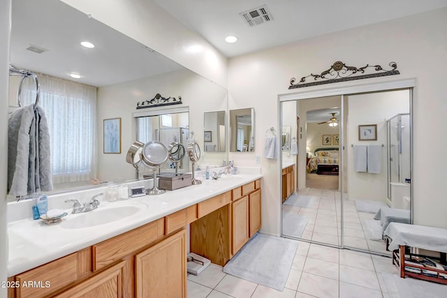 3336 W King Dr, Anthem, AZ 85086 - ensuite bathroom with double vanity, a ceiling fan, tile patterned flooring, a shower with door, and recessed lighting