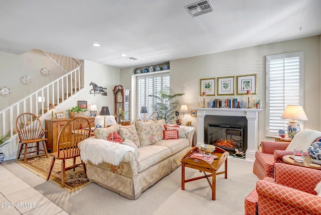 3336 W King Dr, Anthem, AZ 85086 - living area featuring stairway, a glass covered fireplace, and recessed lighting