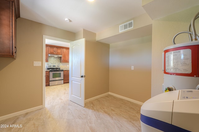 interior space with stainless steel electric stove and backsplash