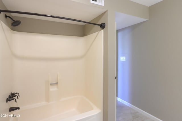 bathroom with bathing tub / shower combination