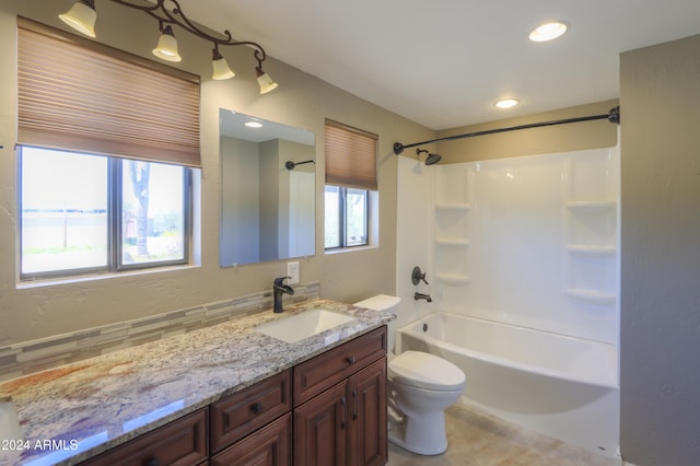 full bathroom featuring shower / tub combination, vanity, tile patterned floors, toilet, and decorative backsplash