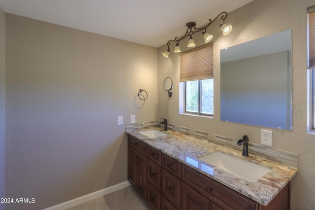 bathroom with vanity and backsplash