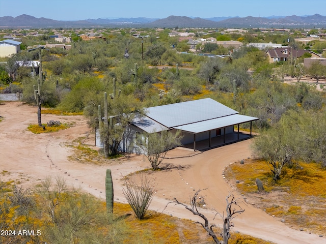 birds eye view of property featuring a mountain view