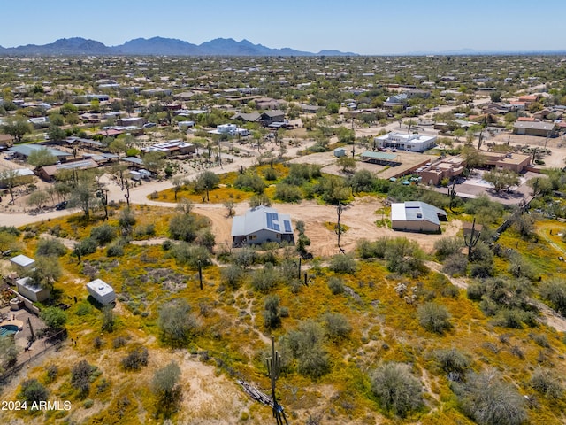 birds eye view of property featuring a mountain view