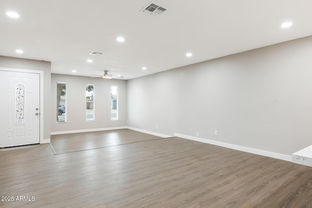 entryway with recessed lighting, visible vents, ceiling fan, and wood finished floors