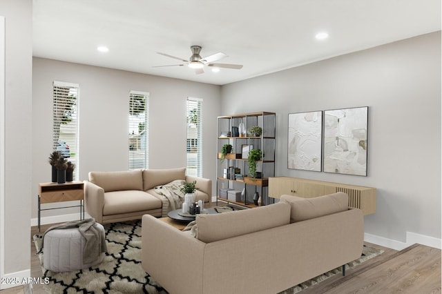 living room with ceiling fan, recessed lighting, wood finished floors, and baseboards