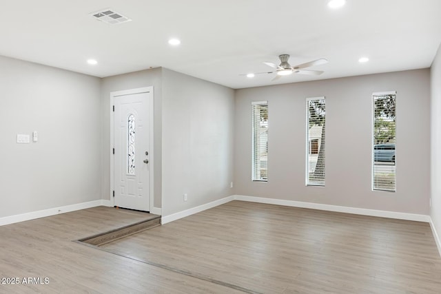 entrance foyer with baseboards, wood finished floors, visible vents, and recessed lighting