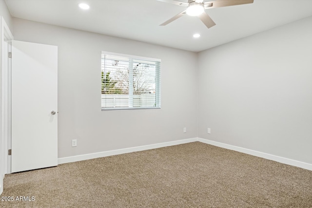 carpeted empty room featuring recessed lighting, ceiling fan, and baseboards