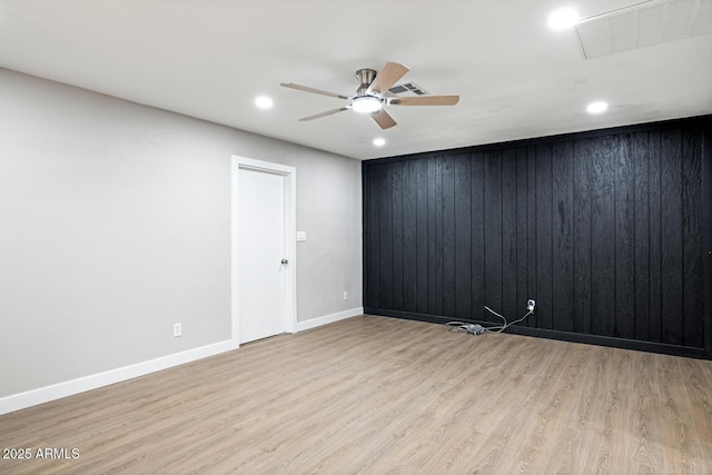 empty room with ceiling fan, baseboards, wood finished floors, and recessed lighting