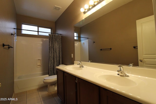 full bathroom with shower / tub combo with curtain, tile patterned floors, toilet, and vanity