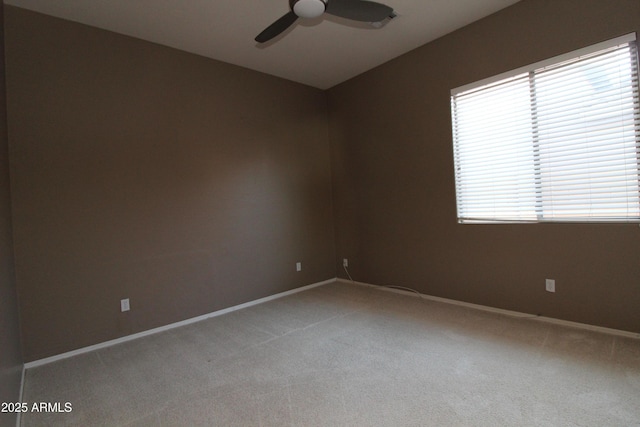 unfurnished room with ceiling fan, lofted ceiling, and carpet