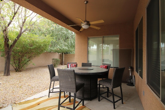 view of patio featuring ceiling fan