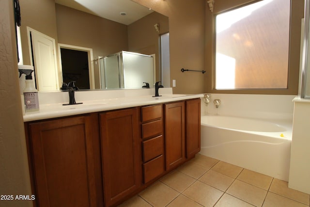 bathroom featuring vanity, independent shower and bath, and tile patterned flooring