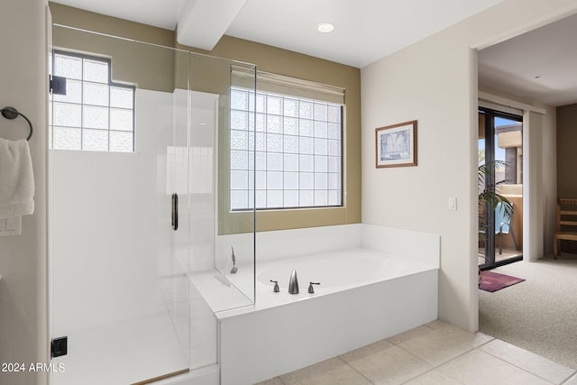 bathroom featuring separate shower and tub and tile patterned flooring