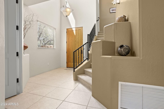 entrance foyer with light tile patterned flooring