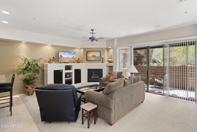 living room with light tile patterned floors and ceiling fan