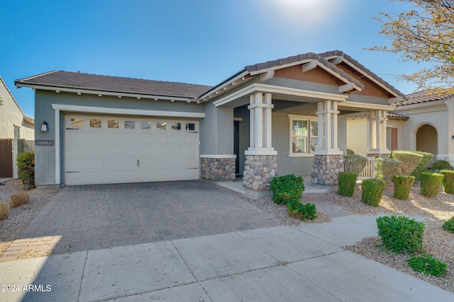 view of front of house with a porch and a garage