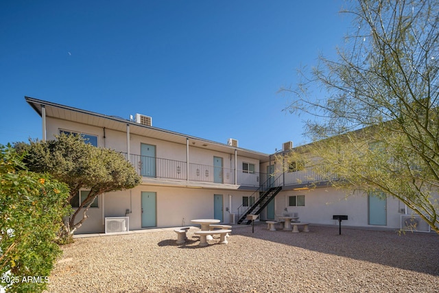 5623 W Myrtle Ave, Glendale, AZ 85301 - back of house featuring stairs and stucco siding