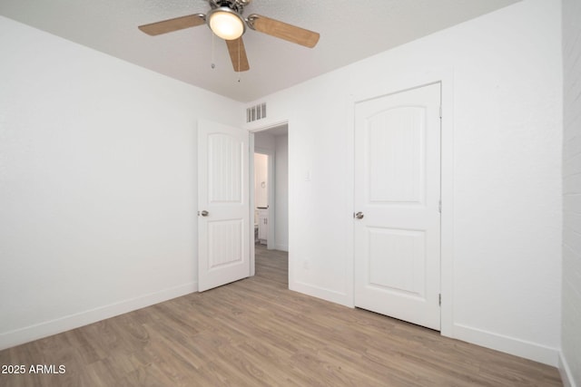 5623 W Myrtle Ave, Glendale, AZ 85301 - unfurnished bedroom with light wood-type flooring, visible vents, and baseboards