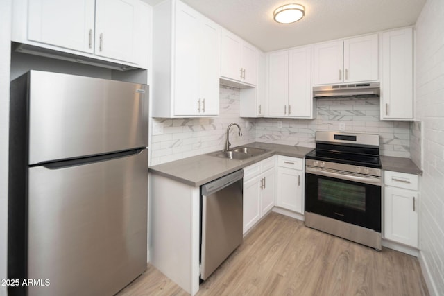 5623 W Myrtle Ave, Glendale, AZ 85301 - kitchen with under cabinet range hood, appliances with stainless steel finishes, white cabinets, and a sink