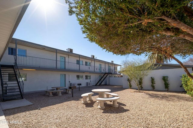 5623 W Myrtle Ave, Glendale, AZ 85301 - back of house with stairs, a patio, and stucco siding