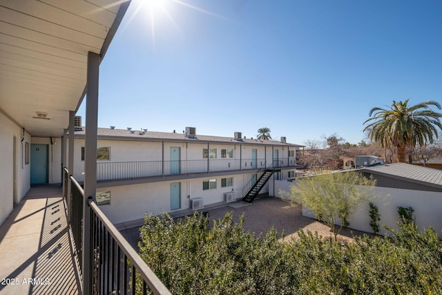 5623 W Myrtle Ave, Glendale, AZ 85301 - balcony featuring stairs and central AC unit