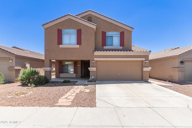 view of front of home with stucco siding, concrete driveway, a garage, a tile roof, and a porch