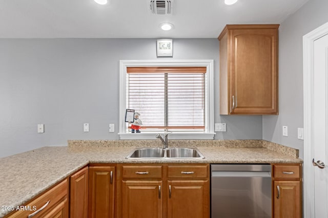 kitchen with dishwasher, a sink, light countertops, recessed lighting, and brown cabinetry
