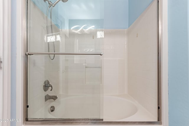 full bath with shower / bath combination with glass door
