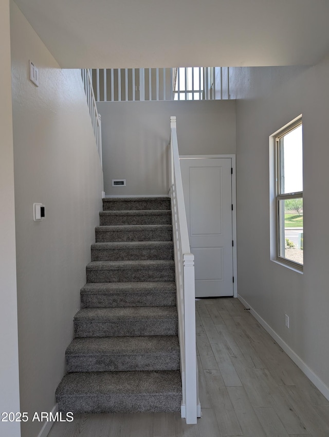 9408 E Sequence Ave, Mesa, AZ 85212 - stairway featuring wood finished floors and baseboards