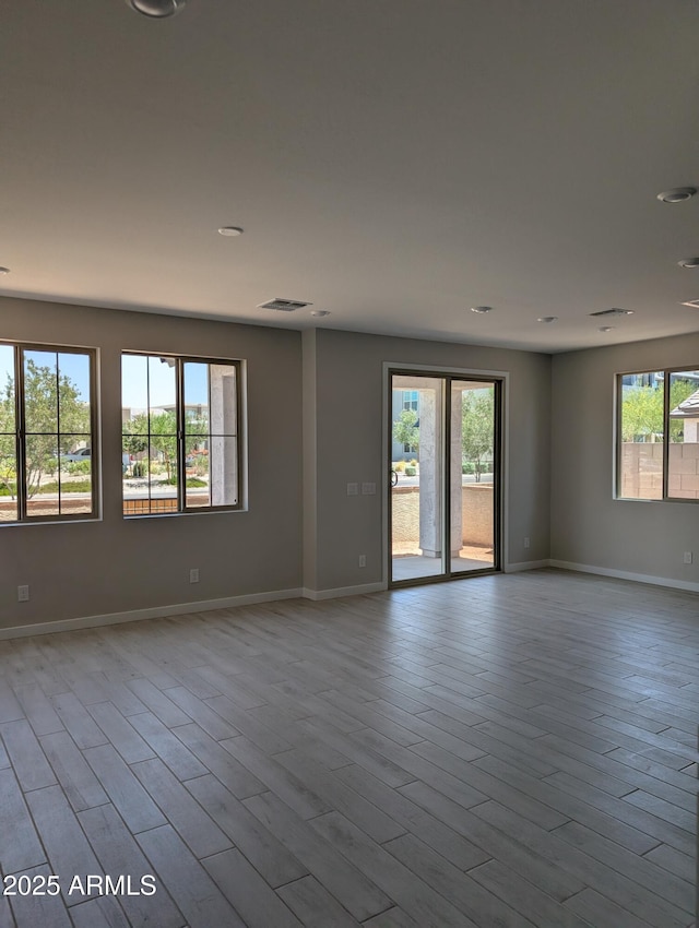 9408 E Sequence Ave, Mesa, AZ 85212 - spare room with baseboards and wood finished floors