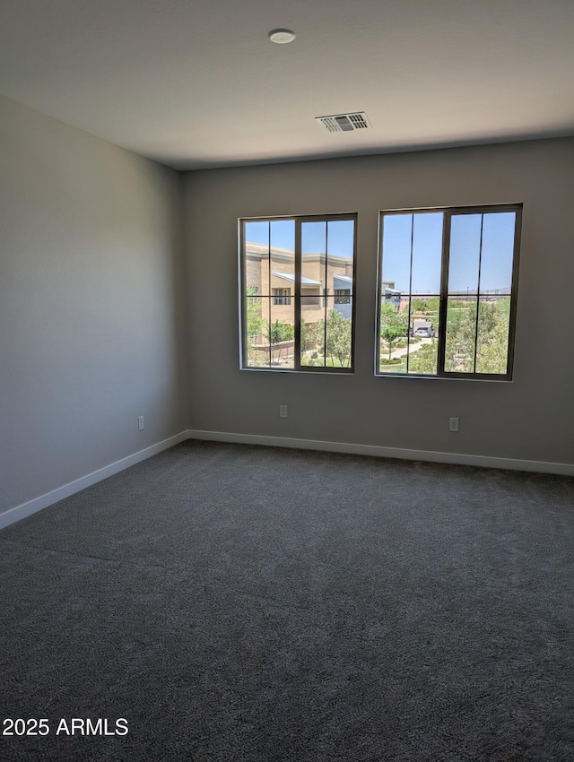 9408 E Sequence Ave, Mesa, AZ 85212 - unfurnished room featuring dark carpet and baseboards