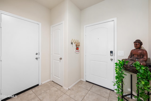 foyer entrance featuring light tile patterned floors