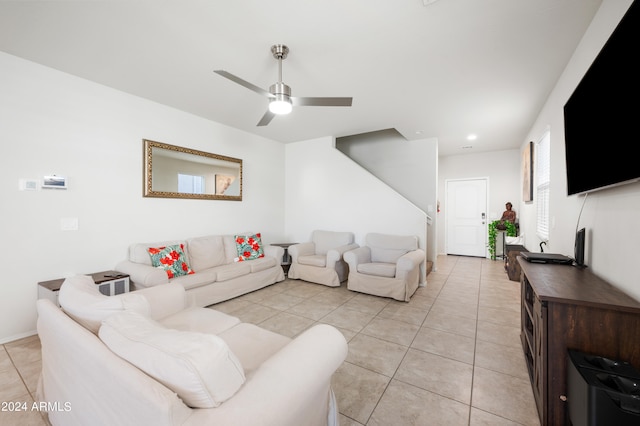 tiled living room with ceiling fan