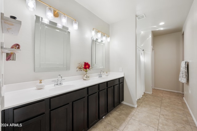 bathroom with vanity and tile patterned floors