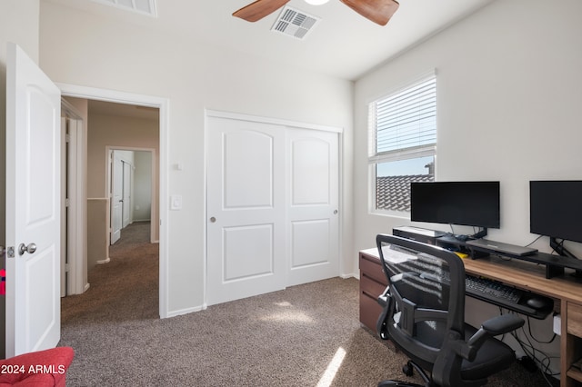 carpeted office featuring ceiling fan