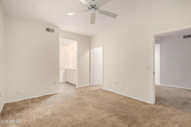7401 W Arrowhead Clubhouse Dr Unit 1006, Glendale, AZ 85308 - unfurnished bedroom featuring ensuite bath, baseboards, visible vents, and light carpet