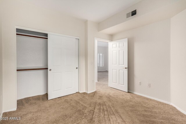 7401 W Arrowhead Clubhouse Dr Unit 1006, Glendale, AZ 85308 - unfurnished bedroom with visible vents, baseboards, carpet, and a closet