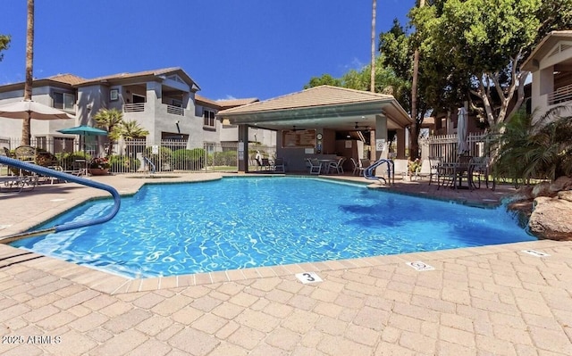 7401 W Arrowhead Clubhouse Dr Unit 1006, Glendale, AZ 85308 - community pool featuring a patio and fence