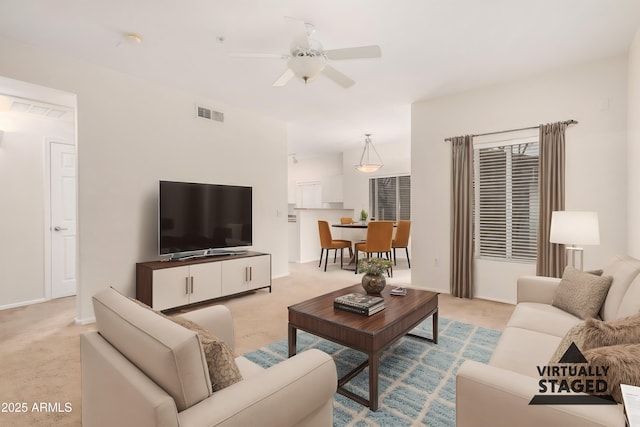 7401 W Arrowhead Clubhouse Dr Unit 1006, Glendale, AZ 85308 - living room featuring visible vents, light carpet, and ceiling fan